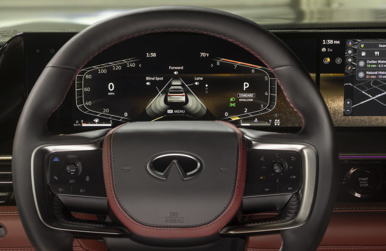 Close-up of the steering wheel and speedometer window in the 2025 INFINITI QX80.
English Disclaimer: US Model Shown 
