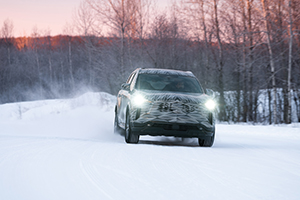 The QX60 driving in the snow.